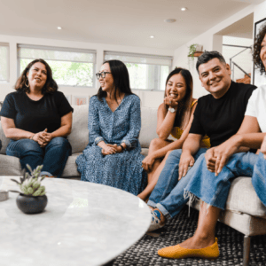 Group of friends talking on a couch