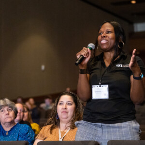 2023 Military Social Work & Behavioral Health Conference attendee asks question at mic