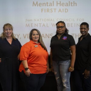 Ashley Craig, second from left, leads a mental health training for veterans and their relatives Friday in John W. Hargis Hall.