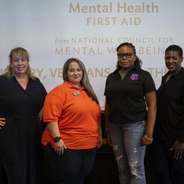 Ashley Craig, second from left, leads a mental health training for veterans and their relatives Friday in John W. Hargis Hall.