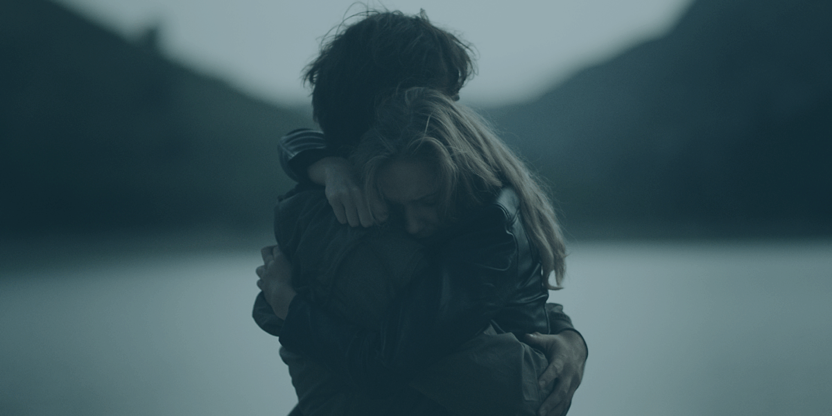 Military and veteran couple embracing during mental health challenges