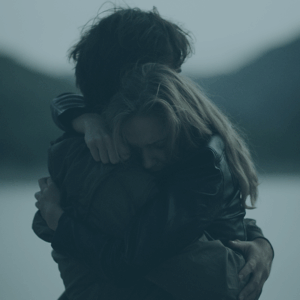 Military and veteran couple embracing during mental health challenges