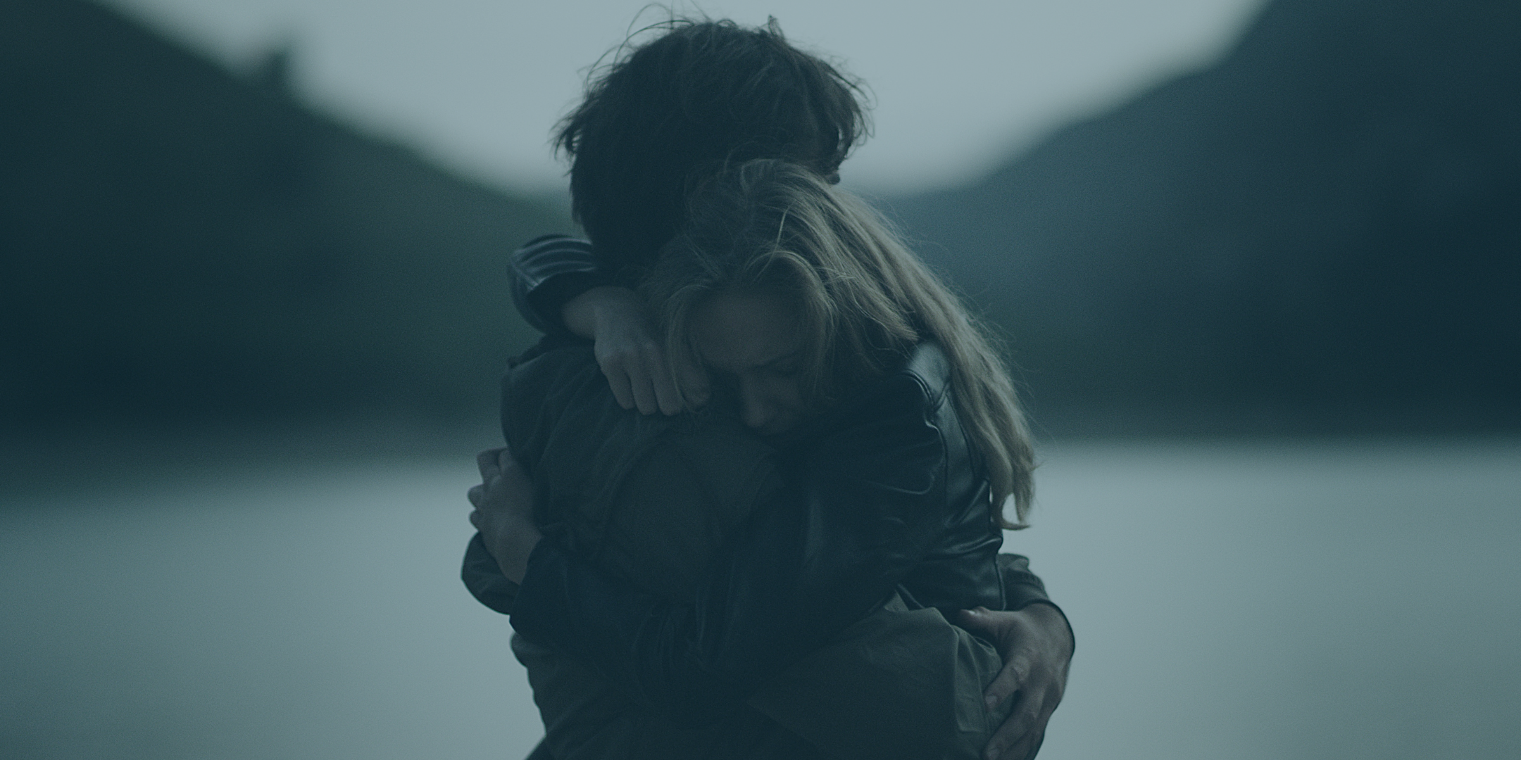 Military and veteran couple embracing during mental health challenges