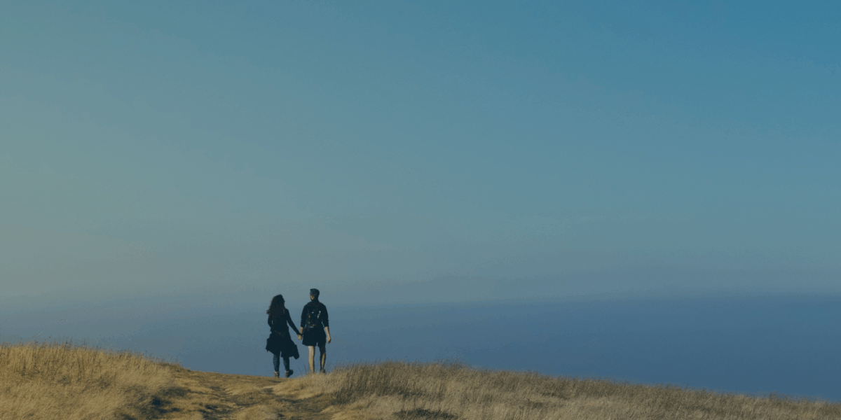 Veteran couple walking together while dealing with PTSD within their relationship