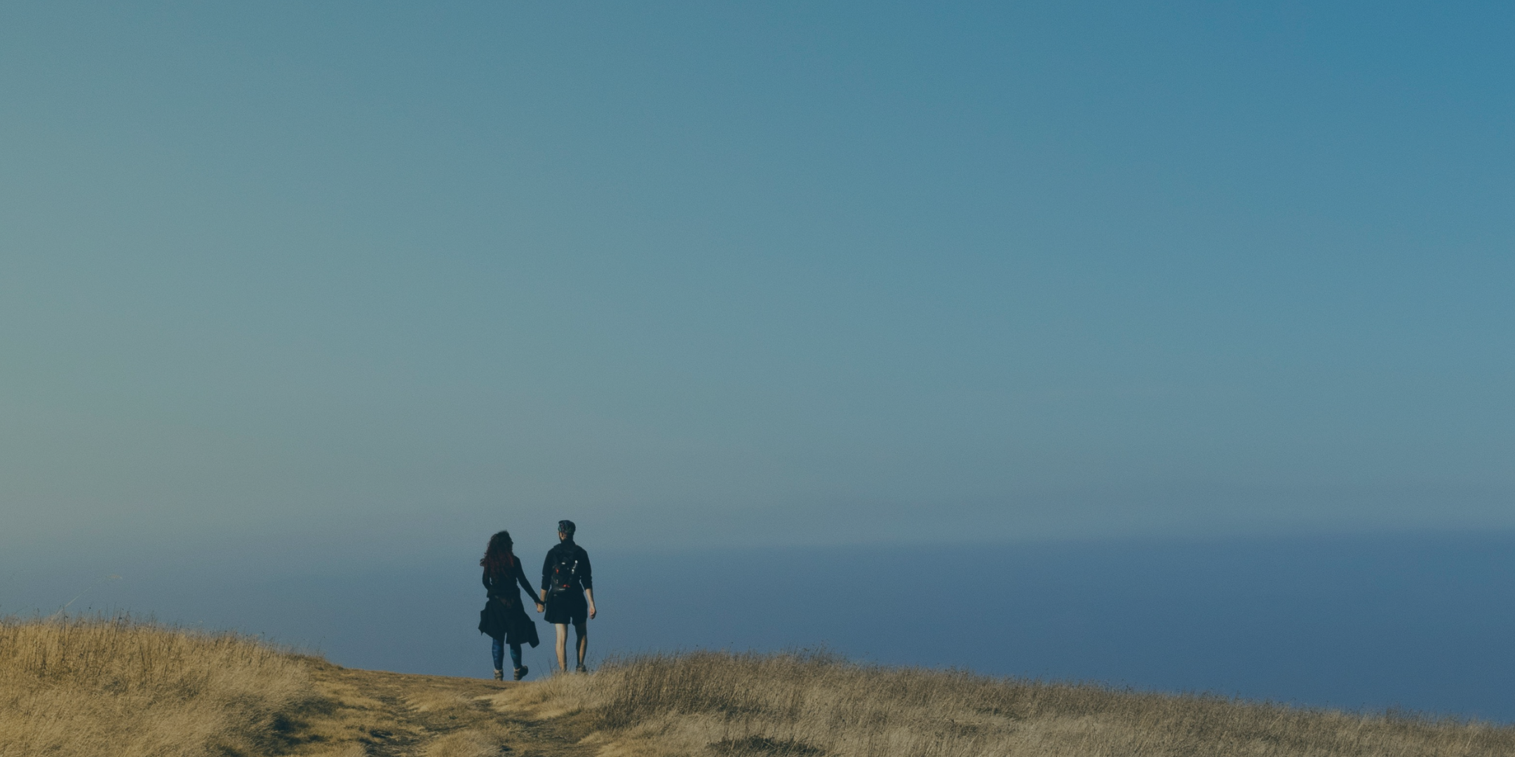 Veteran couple walking together while dealing with PTSD within their relationship