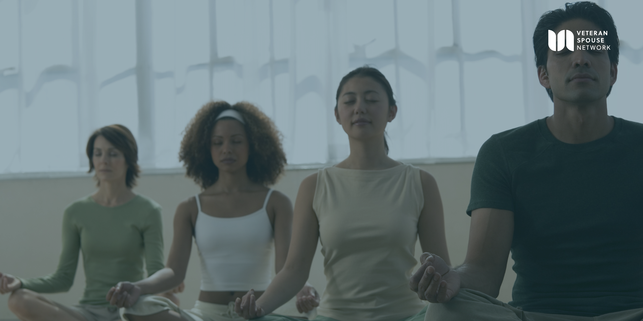 Group of military and veteran community members practicing meditation
