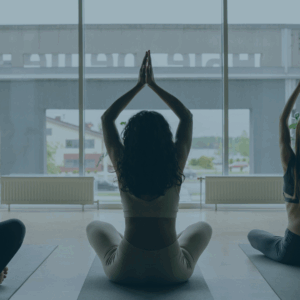 Group of military and veteran spouses and family members practicing introductory yoga