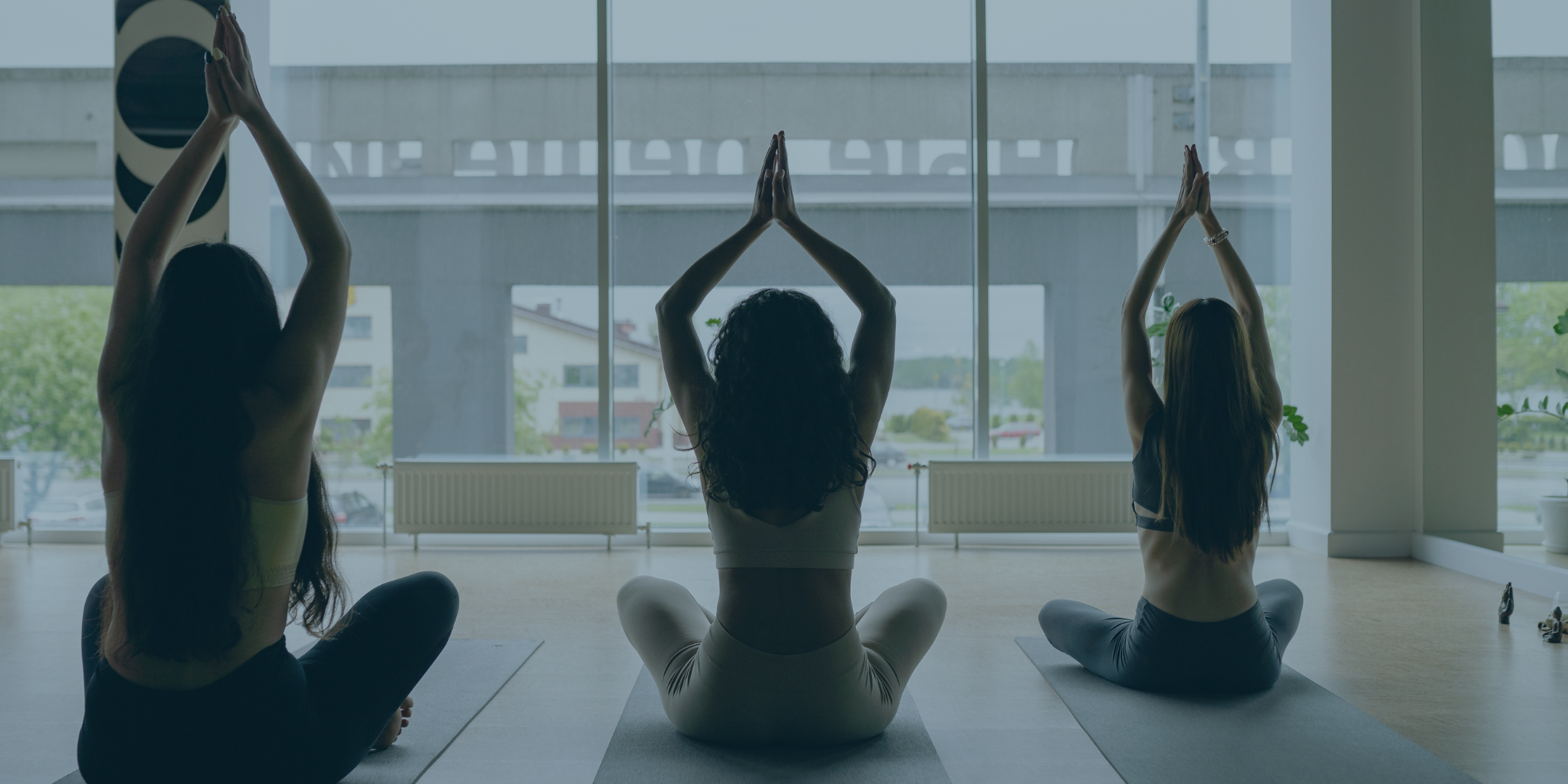 Group of military and veteran spouses and family members practicing introductory yoga