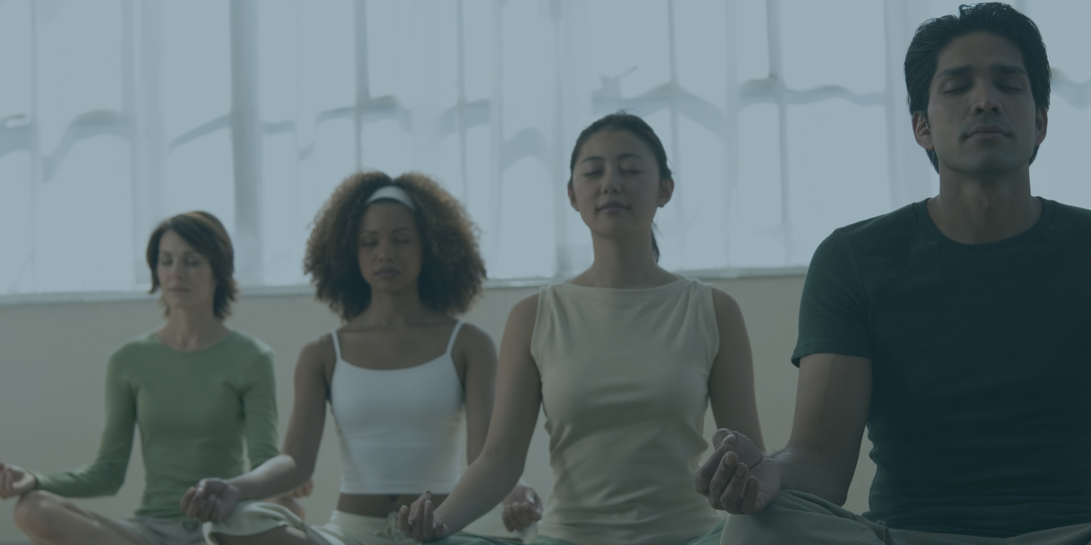 Group of military and veteran community members practicing meditation