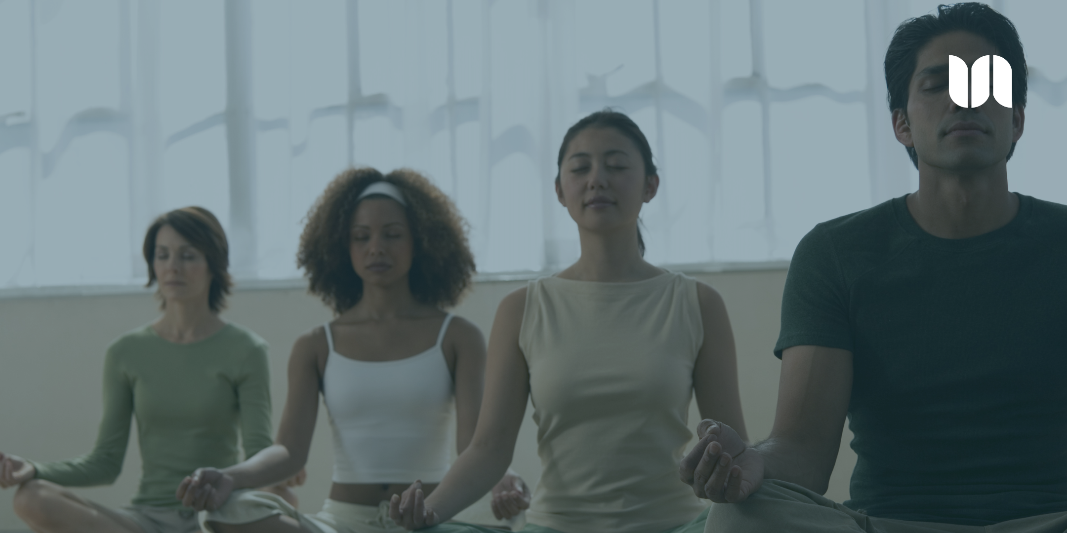 Group of military and veteran community members practicing meditation