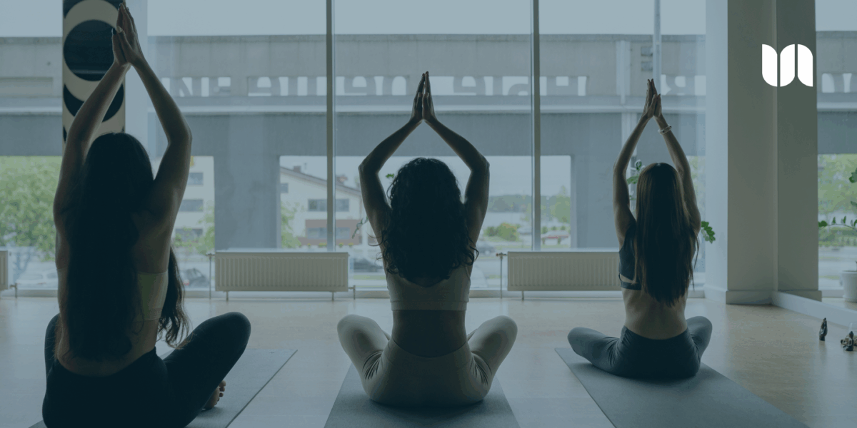 Group of military and veteran spouses and family members practicing introductory yoga